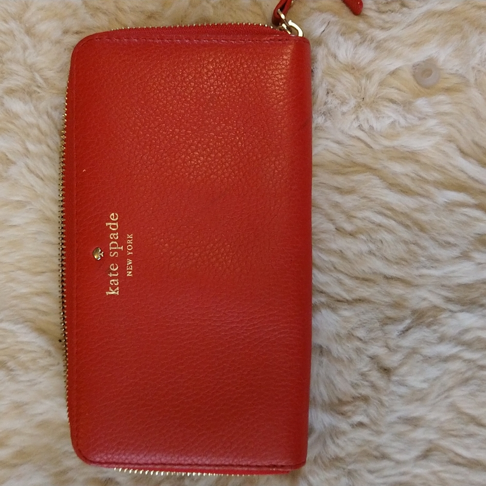 Kate Spade red accordion wallet.
